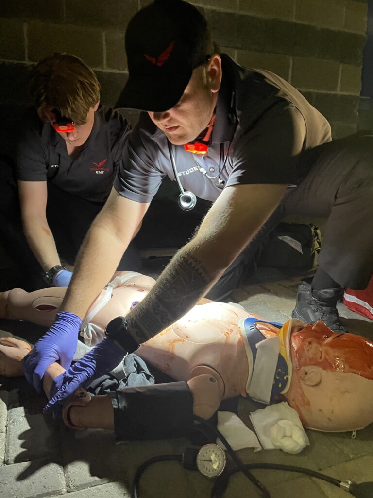 emt students working at night